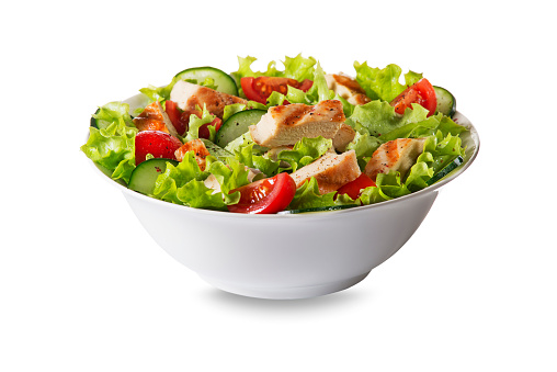 Fresh green salad with chicken breast and tomato isolated on white background
