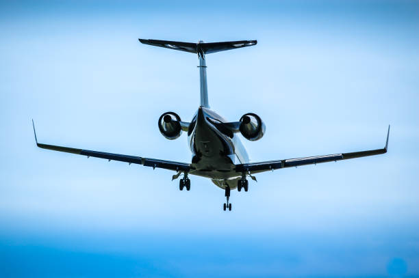 istock Luxurious black jet coming in for landing. 953087296