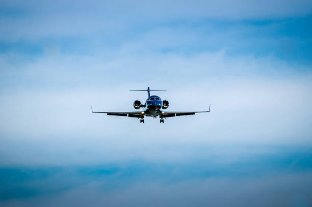 istock Luxurious black jet coming in for landing. 953087298
