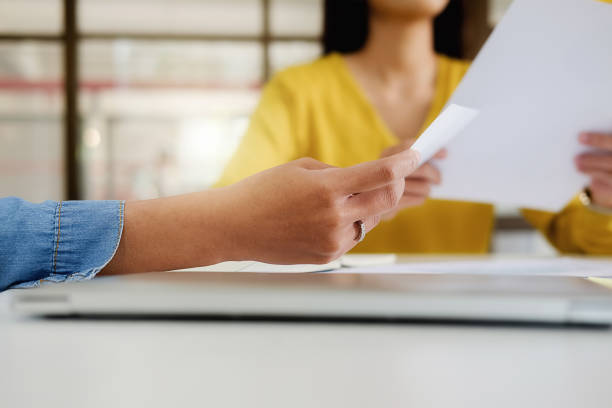istock Business casual adviser analyzing financial figures denoting the progress Internal Revenue Service checking document. Audit concept 953087752