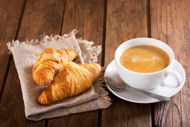istock cup of coffee and croissants 953087962