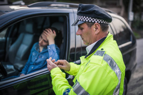 istock Police officer writing traffic ticket 953088108