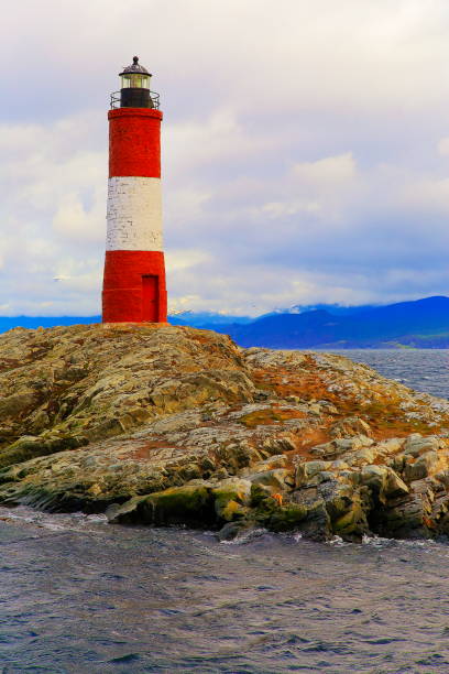 Les Eclaireurs Lighthouse in the Beagle Channel and snowcapped Andes landscape, Ushuaia Les Eclaireurs Lighthouse in the Beagle Channel and snowcapped Andes landscape, Ushuaia - Tierra Del fuego, Argentina – South America les eclaireurs lighthouse photos stock pictures, royalty-free photos & images