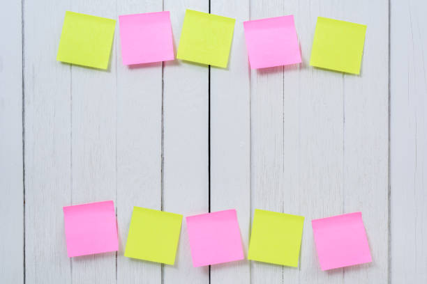 istock Many colorful sticky note, post note on white wooden vintage background 953091620