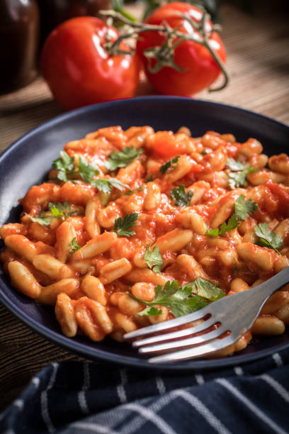 istock Cavatelli pasta with fresh tomato sauce. 953092442