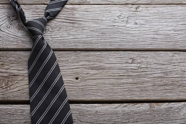 istock Men's fashionable tie on rustic wood background 953094630