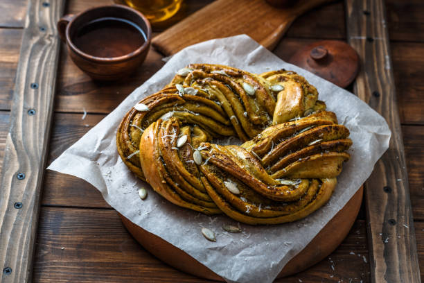 Close view of Babka Brioche Wreath with Pesto and Parmesan stock photo