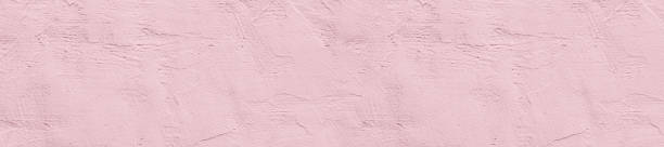 istock panorama pale pink rough textured concrete background 953101108