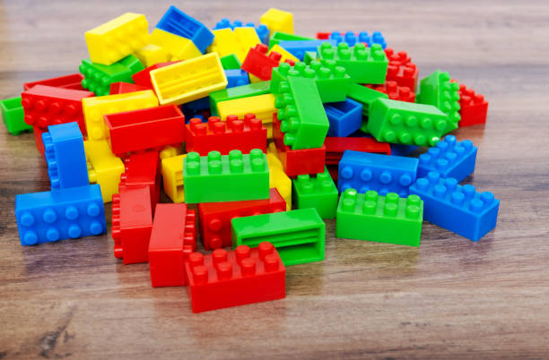 istock Colorful toy building blocks on wood background 953101414