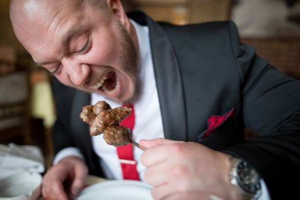 Hungry businessman after work in a restaurant
