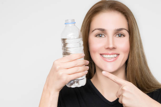 istock Gorgeous blond woman with water bottle in hand 953109020