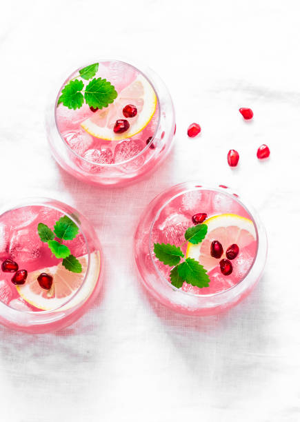 istock Melissa pomegranate low-alcohol summer cocktail on white background, top view. 953109594