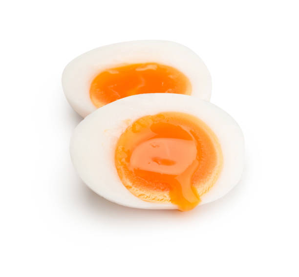 Boiled egg sliced two piece isolated on white background Boiled egg sliced two piece isolated on white background boiled egg photos stock pictures, royalty-free photos & images