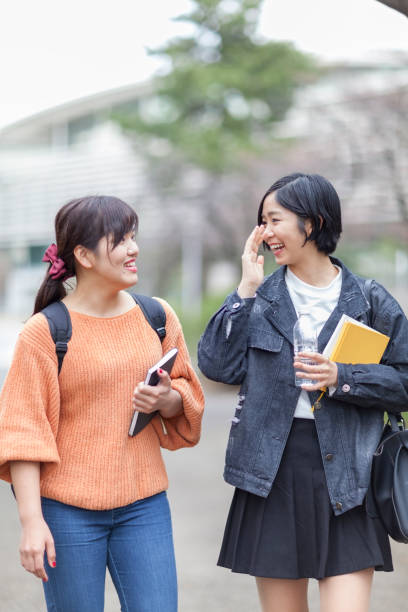 istock Two females students walking to lesson 953127878
