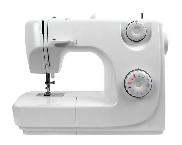 Close-Up Of Sewing Machine On White Background  sewing machine stock pictures, royalty-free photos & images