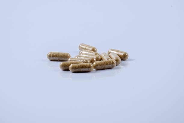 istock Close-Up Of Capsules Over White Background 953135940