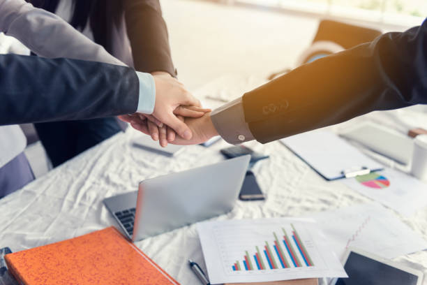 istock Business team showing unity with their hands together, Business concept 953140006