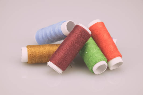 istock Close-Up Of Colorful Thread Spools On White Background 953143698