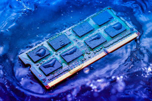 istock Close-Up Of Computer Chip Falling In Colorful Water 953143872