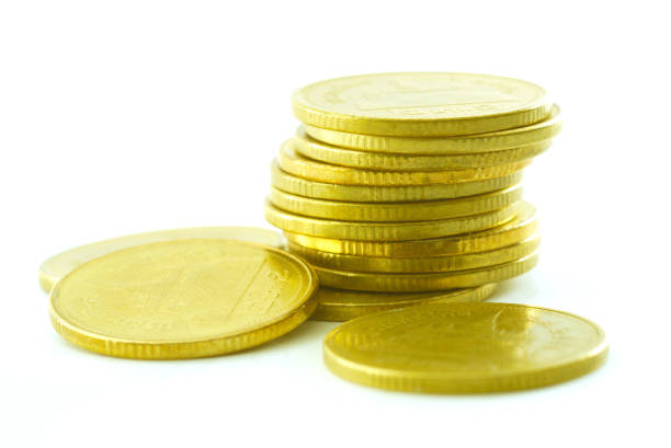 istock Close-Up Of Coins Over White Background 953146476