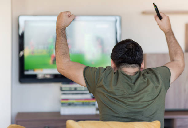 istock Man Watching Football Match 953149028
