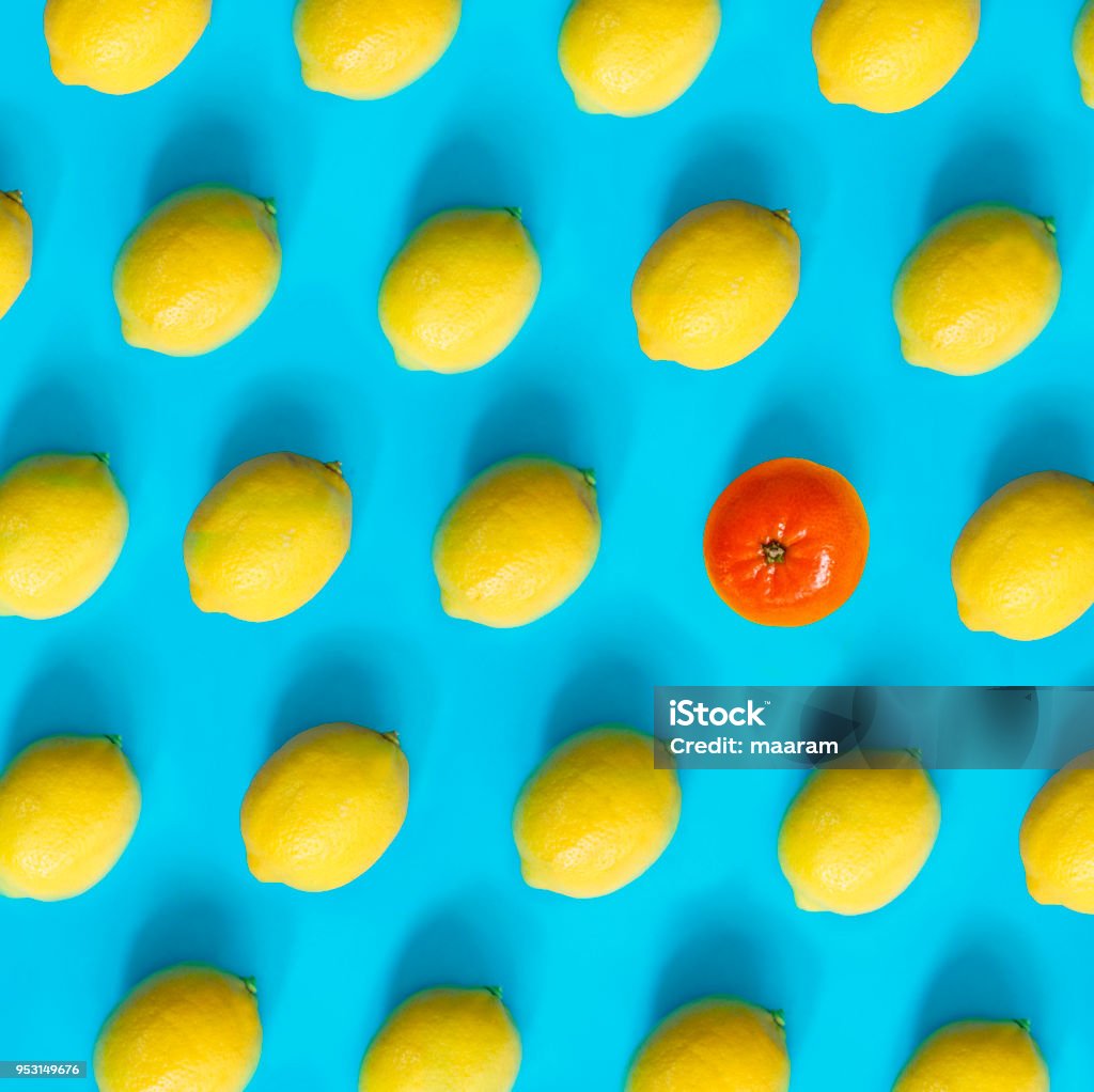 lemons pattern with only one mandarin Individuality Stock Photo