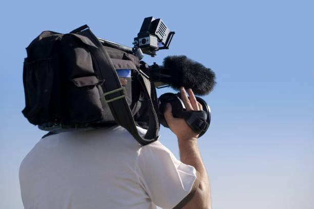 professional video cameraman in full action with cold environment.