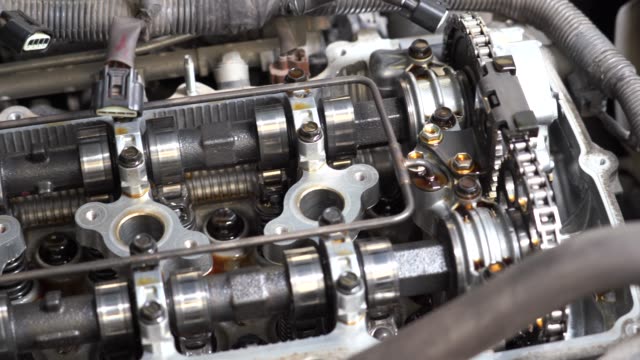4k movie of Detail of parts to an old engine in pickup truck