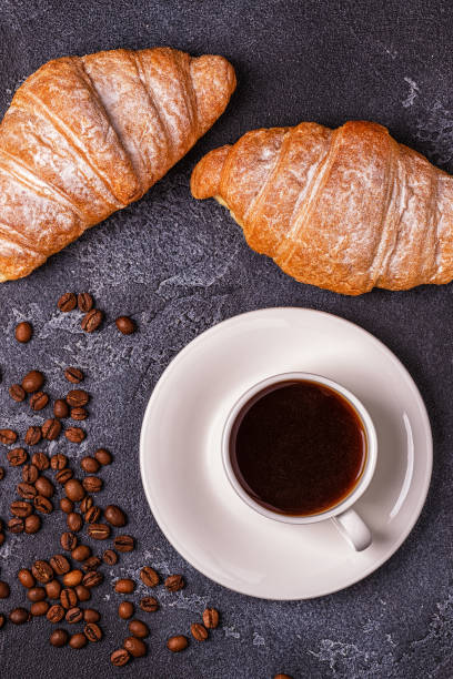 istock Breakfast with fresh croissants, orange juice and coffee, top view. 953153024