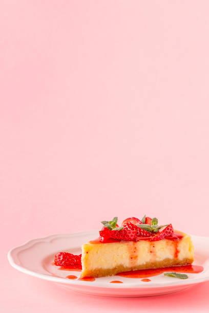 istock homemade cheesecake with strawberries on pink background 953155328