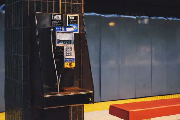 Photo of Public phone installed on subway pillar