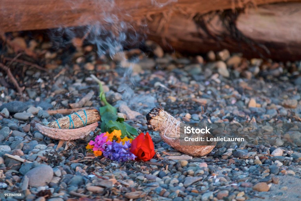 Smudging Smudging ritual incense, flowers,rocks Bundle Stock Photo