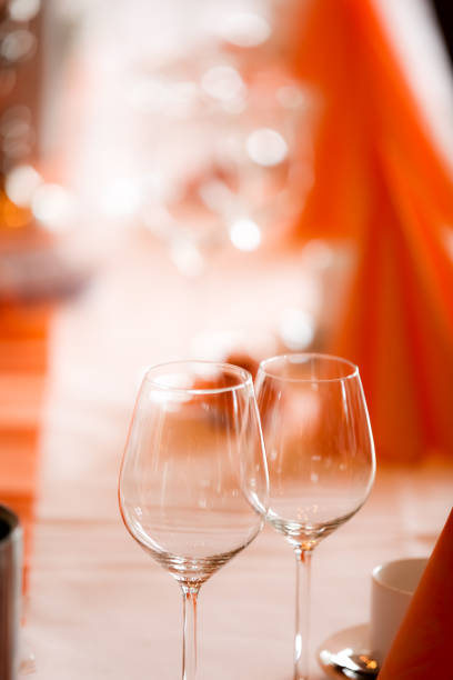 istock Glasses and plates on table in restaurant 953164678