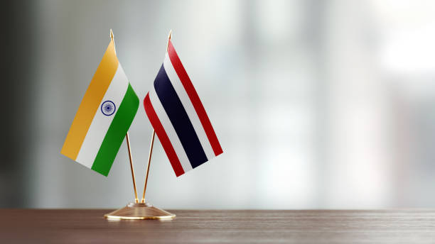 istock Indian And Thai Flag Pair On A Desk Over Defocused Background 953164944