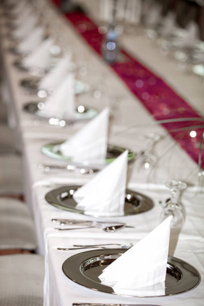 istock Glasses and plates on table in restaurant 953165040