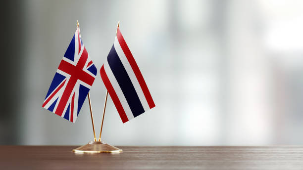 istock British And Thai Flag Pair On A Desk Over Defocused Background 953165360