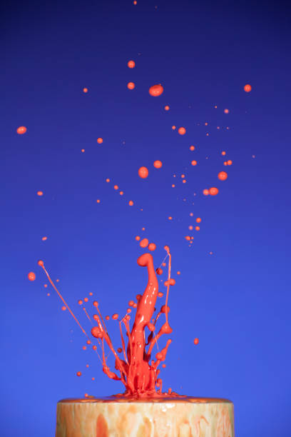 istock Splash of colorful liquid on blue background 953172470