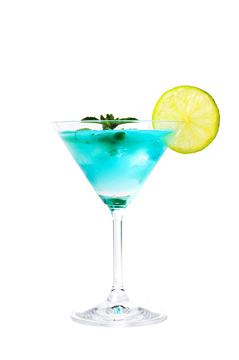 Blue cocktails decorated with lemon on matching background