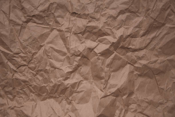 istock Brown rough crumpled recycled paper texture 953173368