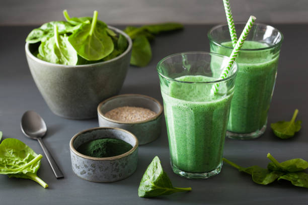 istock green spinach smoothie with spirulina, chia seed, lime, apple 953173388