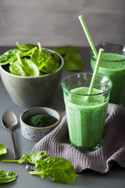 istock green spinach smoothie with spirulina, chia seed, lime, apple 953173778
