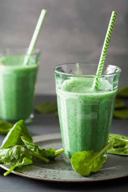 istock green spinach smoothie with spirulina, chia seed, lime, apple 953174130
