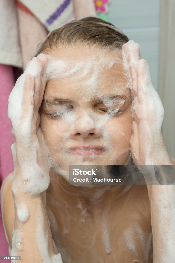 A Teenage Girl Soaped With A Soapy Foam Face Bathing In The Bathroom