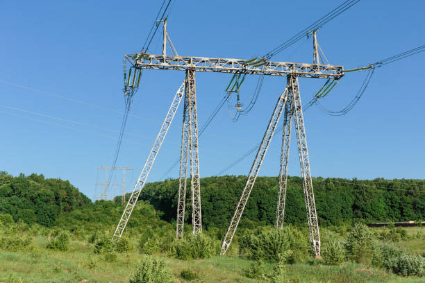 istock Electricity pylon power pole high voltage against blue sky 953180942