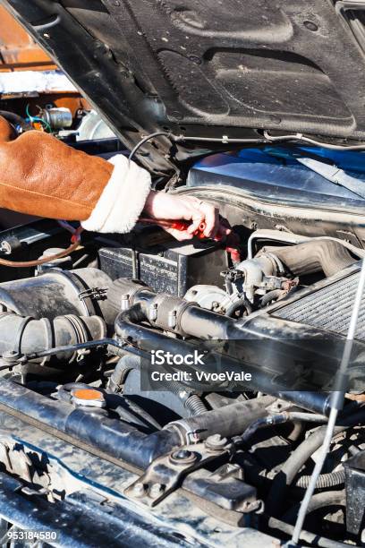 Jumpstart A Dead Car Battery With Another Vehicle Stock Photo - Download Image Now - Car, Jumping, Winter