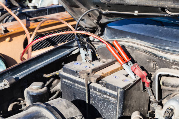 istock Jump start a flat car battery with another vehicle 953187986