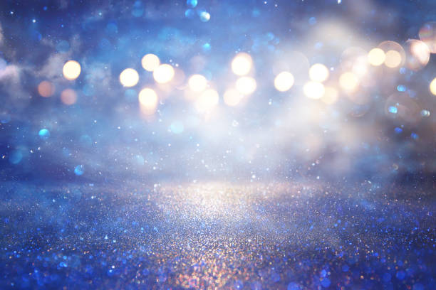 istock glitter vintage lights background. silver and blue. de-focused. 953192392