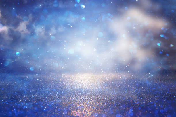 istock glitter vintage lights background. silver and blue. de-focused. 953192434