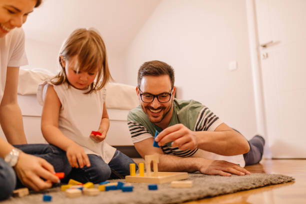 istock Young family is having fun time while they are playing in bedroom 953193408