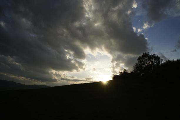 istock Sunrise and sunset over the hills and town. 953201920